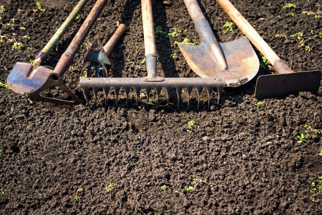Garden tools on fine soil
