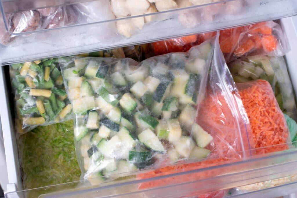 Chopped up frozen courgettes in freezer