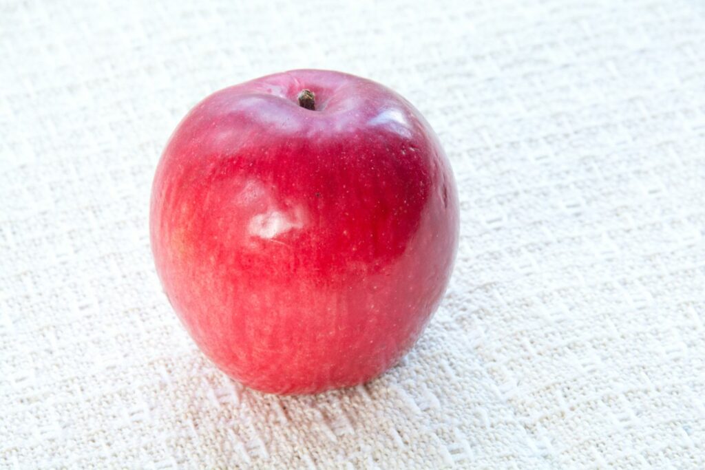 round, dark red liberty apple