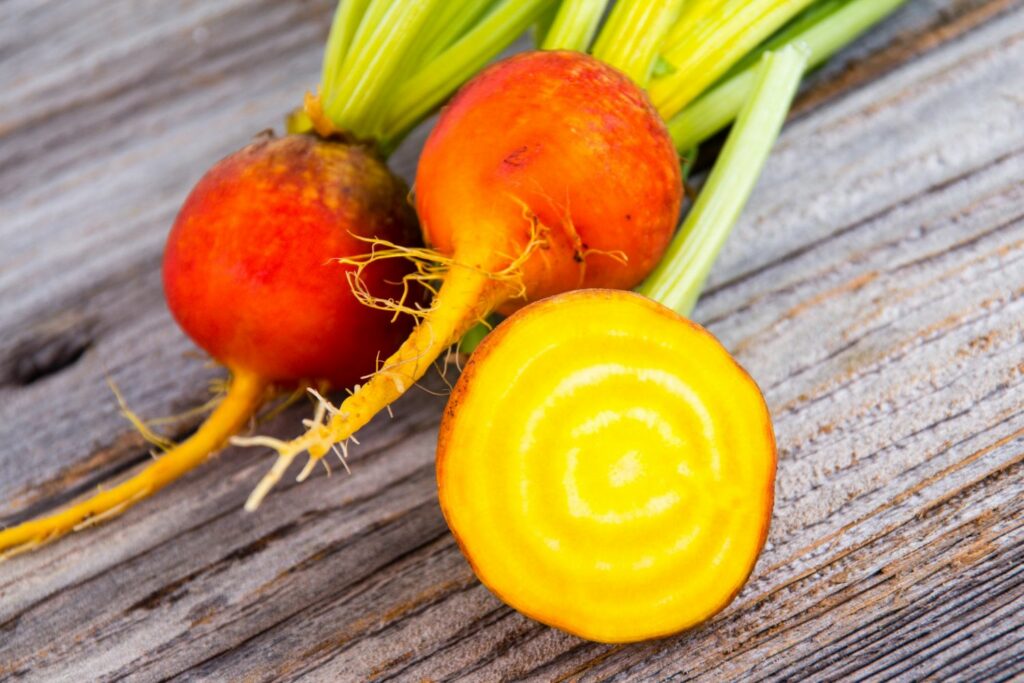 Whole and sliced yellow beetroot
