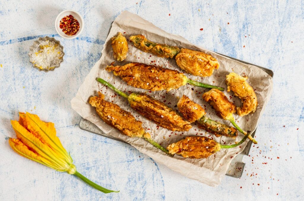 stuffed courgette flowers on tray