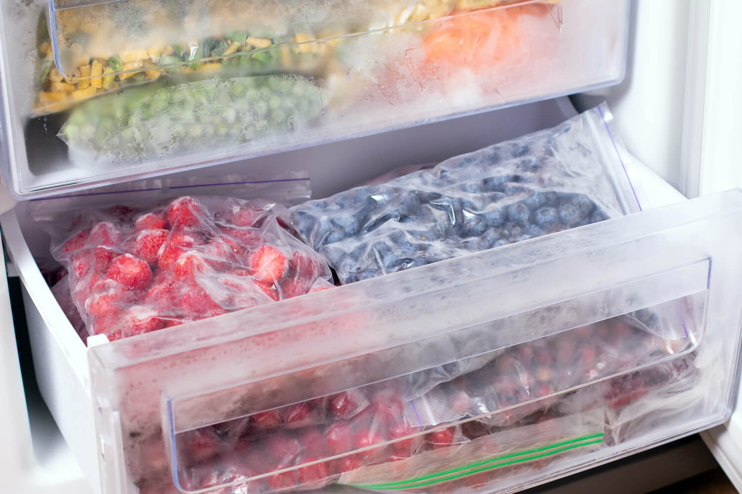 Bags of berries in freezer