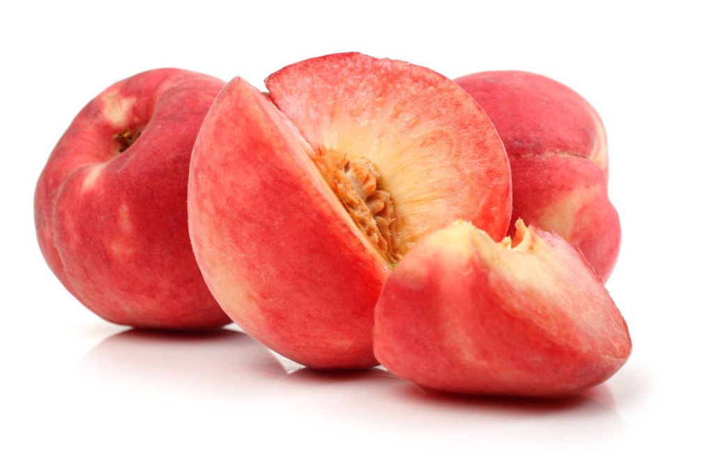 sliced peaches with red flesh